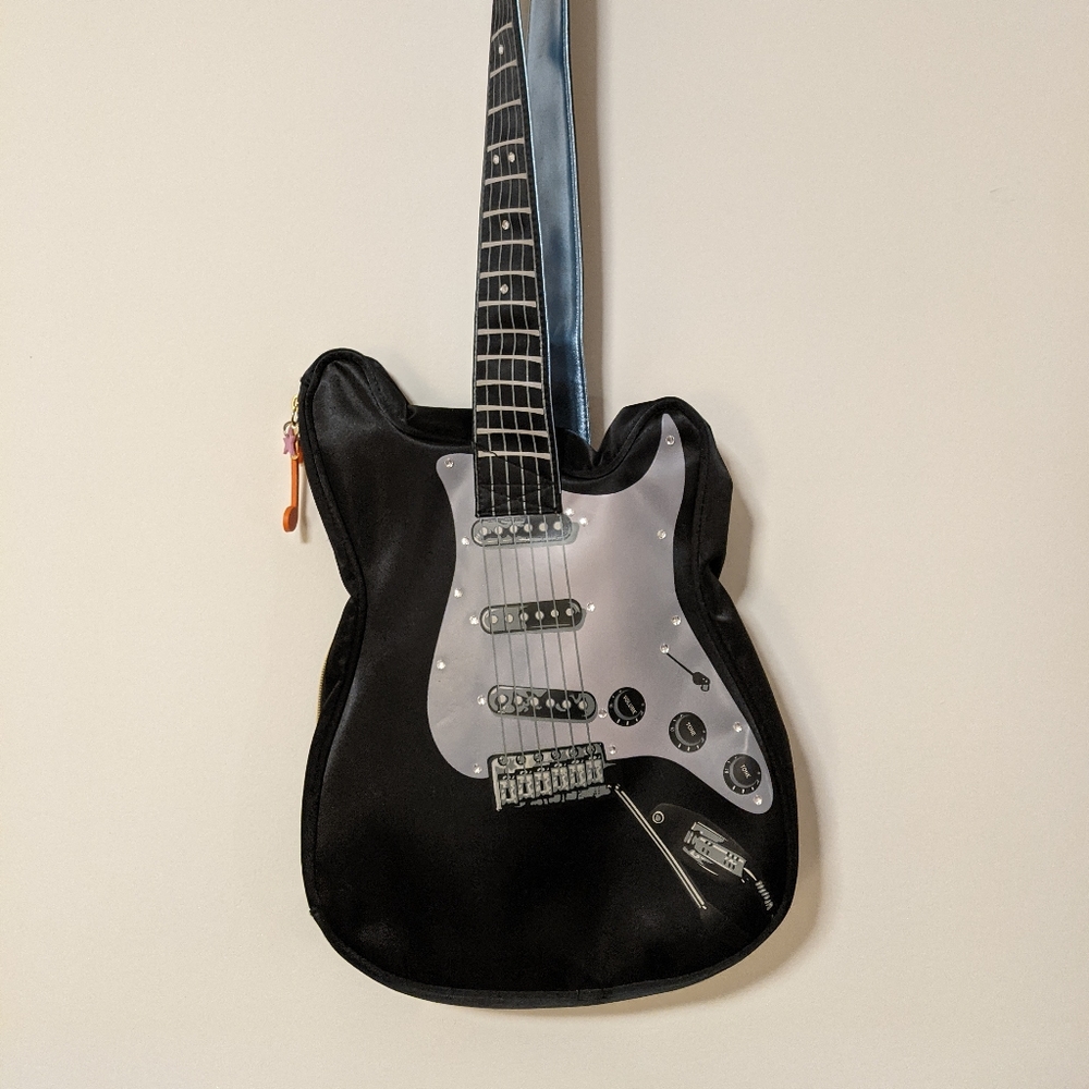 Parcel guitar sling bag purse